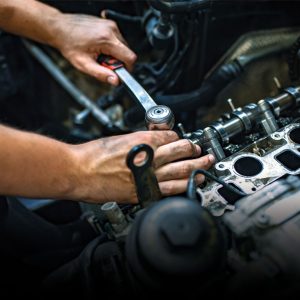 Close-up of a mechanic working on a car engine